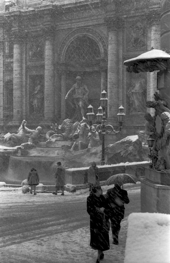 Snowy street with fountain